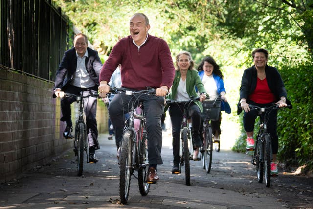 LibDem leader Sir Ed Davey alongside West Country MPs and key candidates as they arrive by bicycle for the Liberal Democrat conference (Stefan Rousseau/PA)
