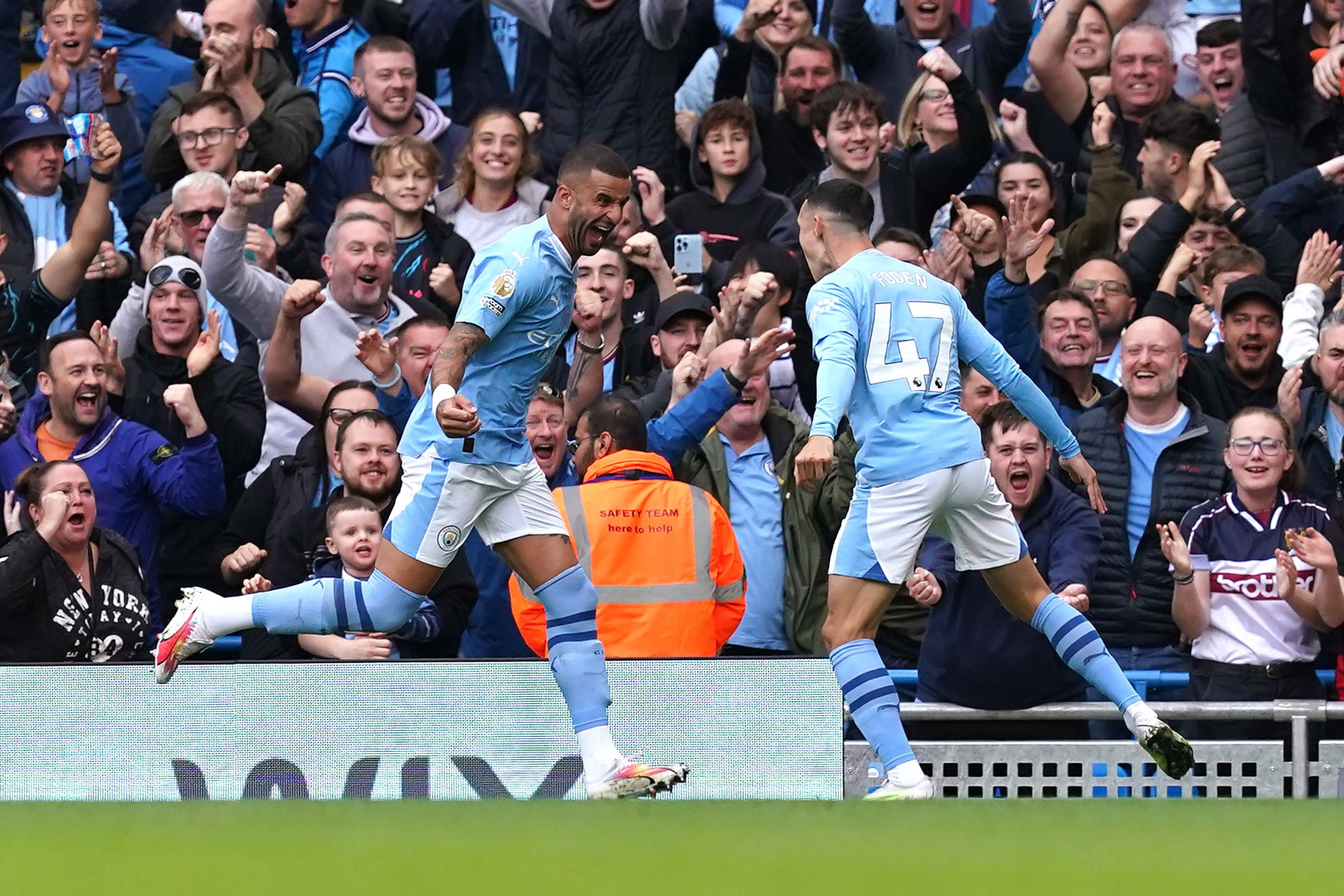 Manchester City’s Phil Foden (right) celebrates scoring his side’s first goal of the game with team-mate Kyle Walker. (Martin Rickett/PA)