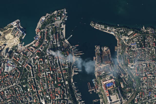 <p>A satellite image shows smoke billowing from a Russian Black Sea Navy HQ after a missile strike, as Russia's invasion of Ukraine continues, in Sevastopol, Crimea</p>