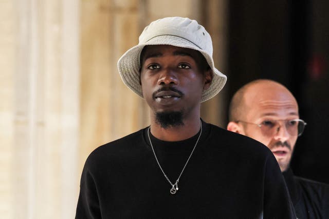 <p>French rapper Mohamed Sylla, aka MHD, arrives for the opening of his and eight other men’s trial </p>