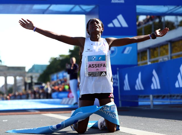 <p>Ethiopia’s Tigist Assefa celebrates after breaking the world record</p>