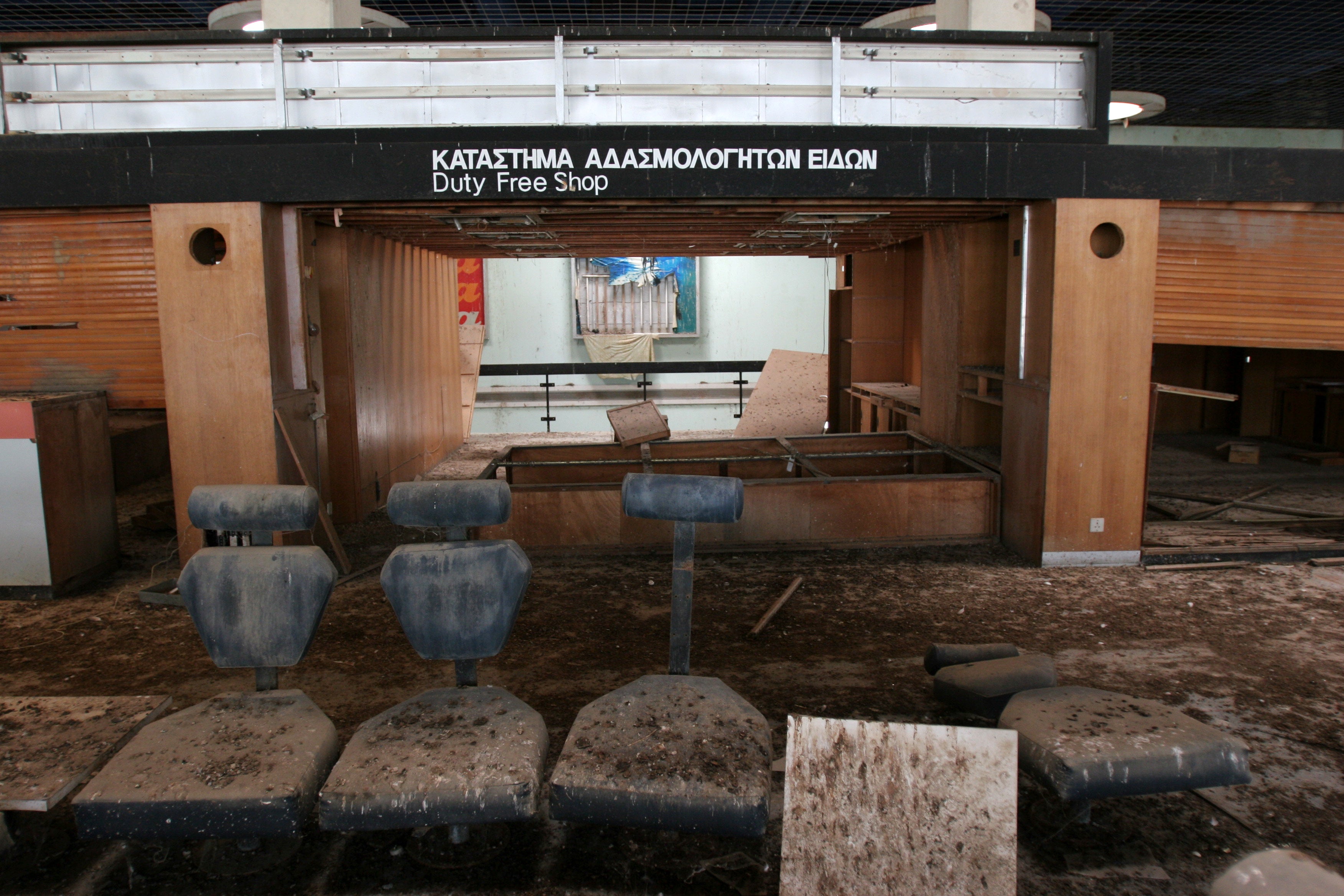 Shrapnel now lines the dusty floors of the Duty Free Shop