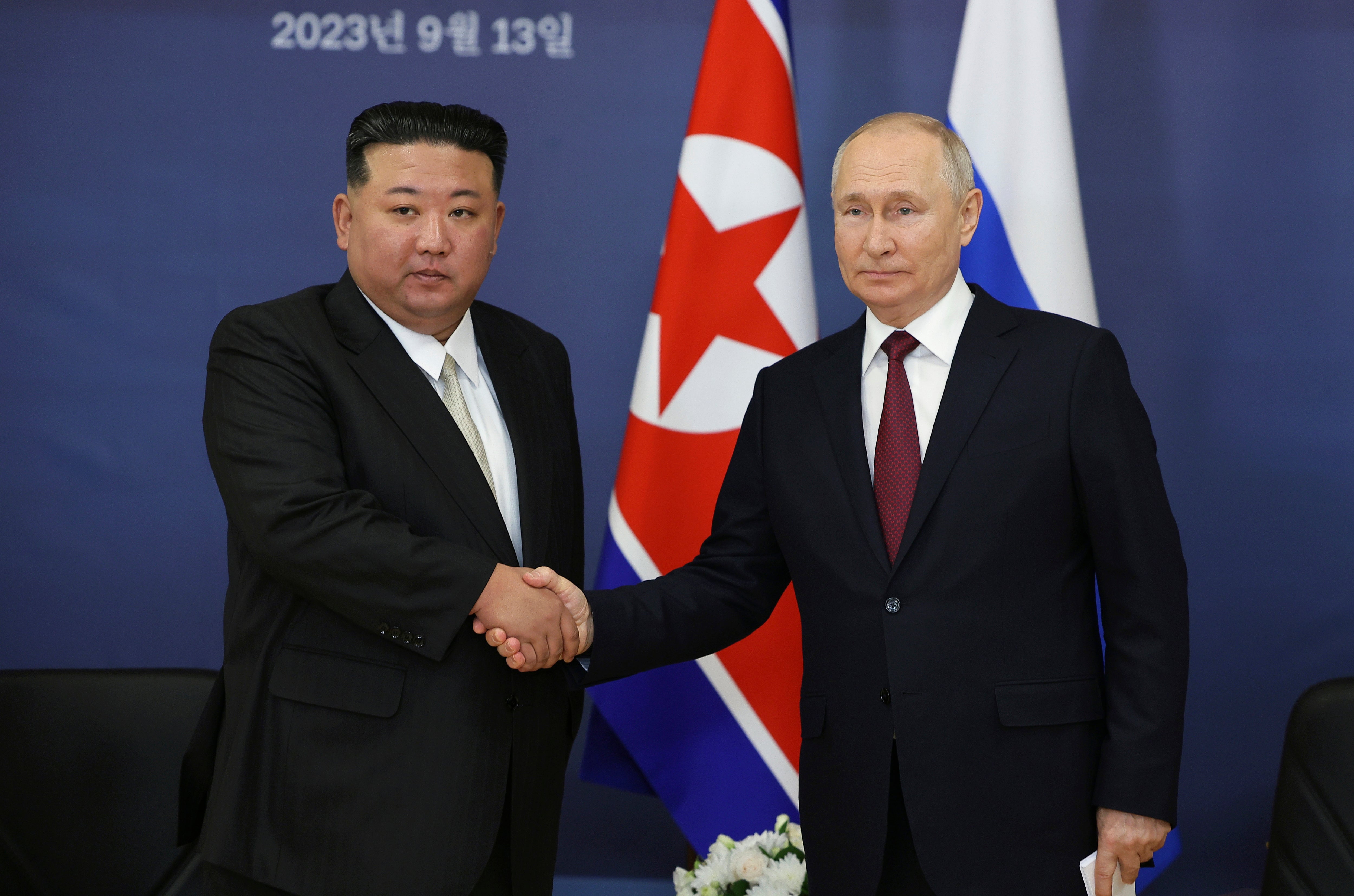 Russian president Vladimir Putin and North Korea’s leader Kim Jong-un shake hands during their meeting at the Vostochny cosmodrome in September this year