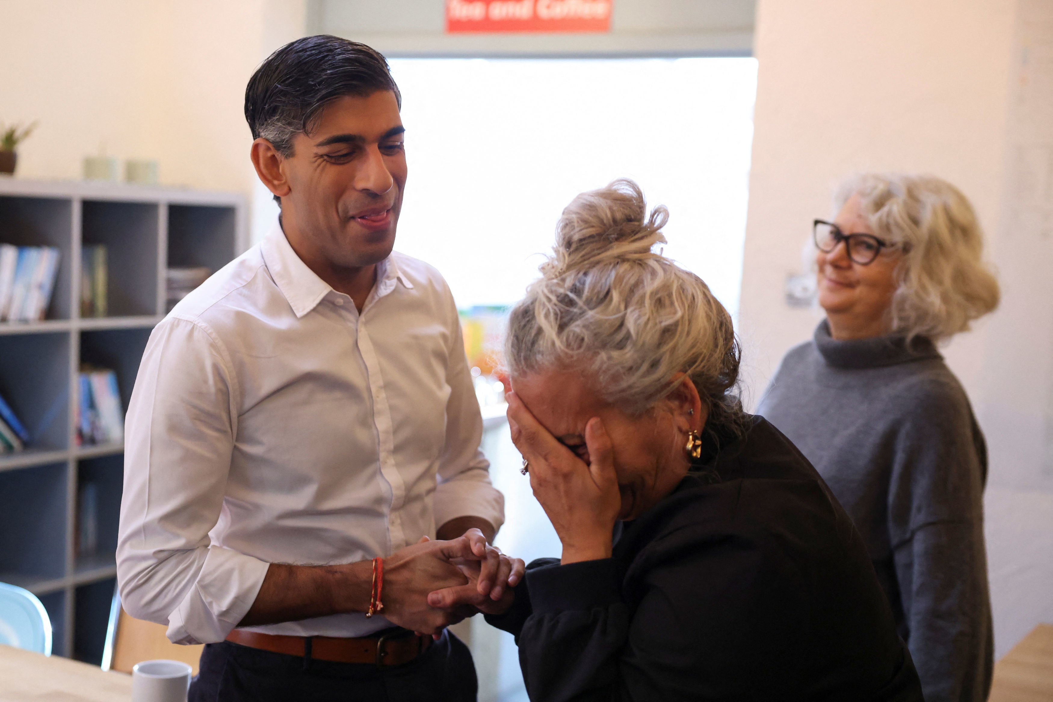 Prime minister Rishi Sunak speaks with a member of the community during a breakfast club at Wormley Community Centre in Hertfordshire.