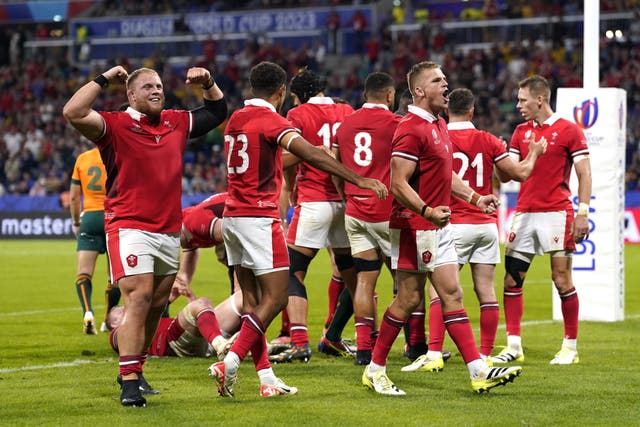 Wales players celebrate after beating Australia in Lyon (Andrew Matthews/PA)