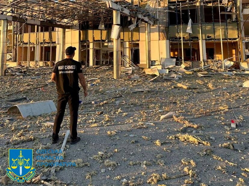 A member of Odesa Regional Prosecutor's Office personnel inspects damage following a Russian military attack