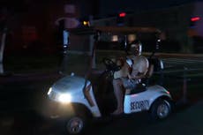 Shirtless man driving stolen golf cart with dog on his lap chased by police