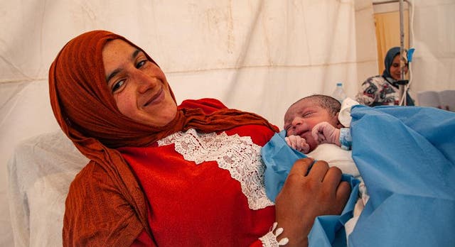 <p>Nezha gave birth to her third child, Anas, in a makeshift tent</p>