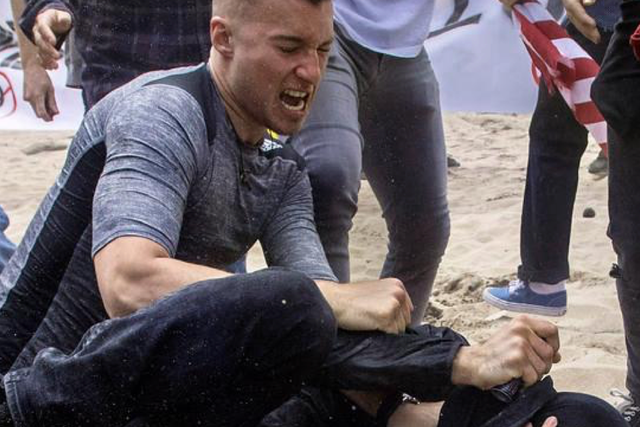 <p>Robert Rundo, among the chief organizers in  a movement of white supremacist “active clubs”, was pictured attacking counter protesters at a rally in California in 2017.</p>