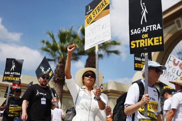 <p>Striking SAG-AFTRA members picket with striking WGA members outside Paramount Studios on 18 September 2023 in Los Angeles, California</p>