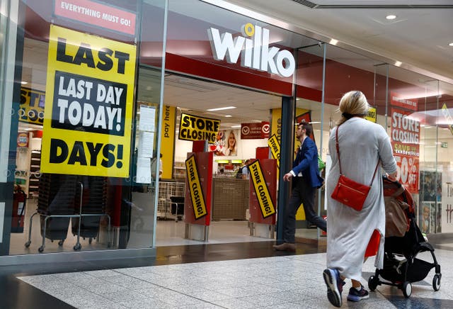 <p>Shoppers walk past a Wilko store in Putney on September 12, 2023 in London</p>