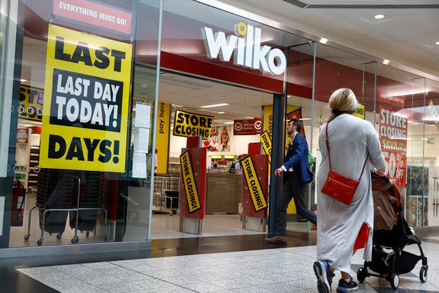 <p>Shoppers walk past a Wilko store in Putney on September 12, 2023 in London</p>