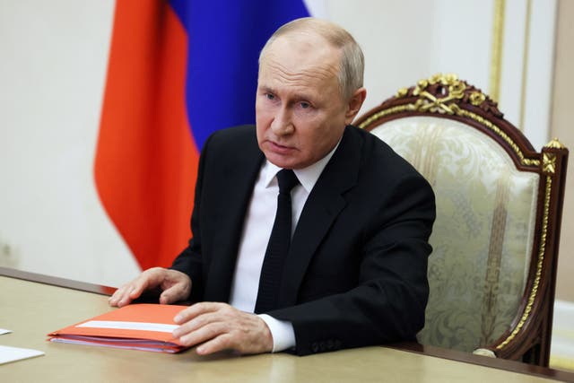 <p>Russian president Vladimir Putin chairs a meeting with members of the Security Council via a video conference at the Kremlin in Moscow</p>