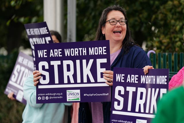 School support workers, who are members of Unison, Unite and GMB Scotland, on the picket line at Portobello High School in Edinburgh (Jane Barlow/PA)