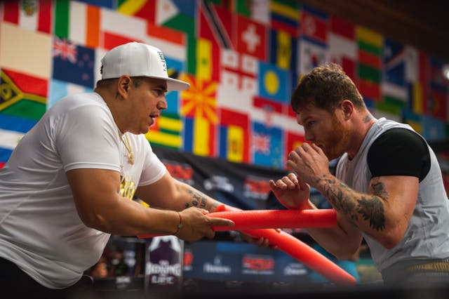 <p>Saul ‘Canelo’ Alvarez (right) with his coach and manager Eddy Reynoso </p>