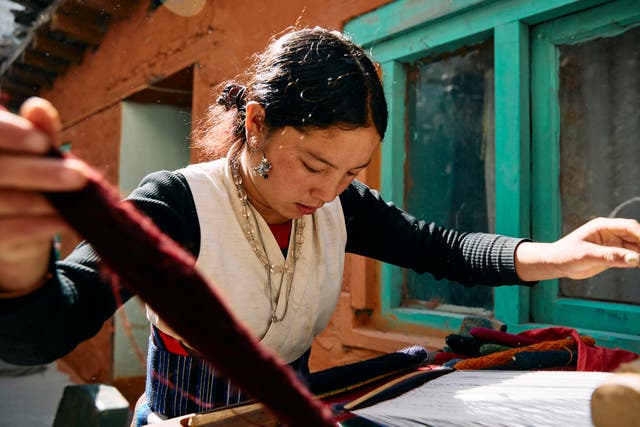 <p>Chiring Dhaka Gurung, 22, says: ‘Symrik Cashmere is helping women in these remote regions to be able to support themselves through training in faster weaving techniques which increases output’ </p>