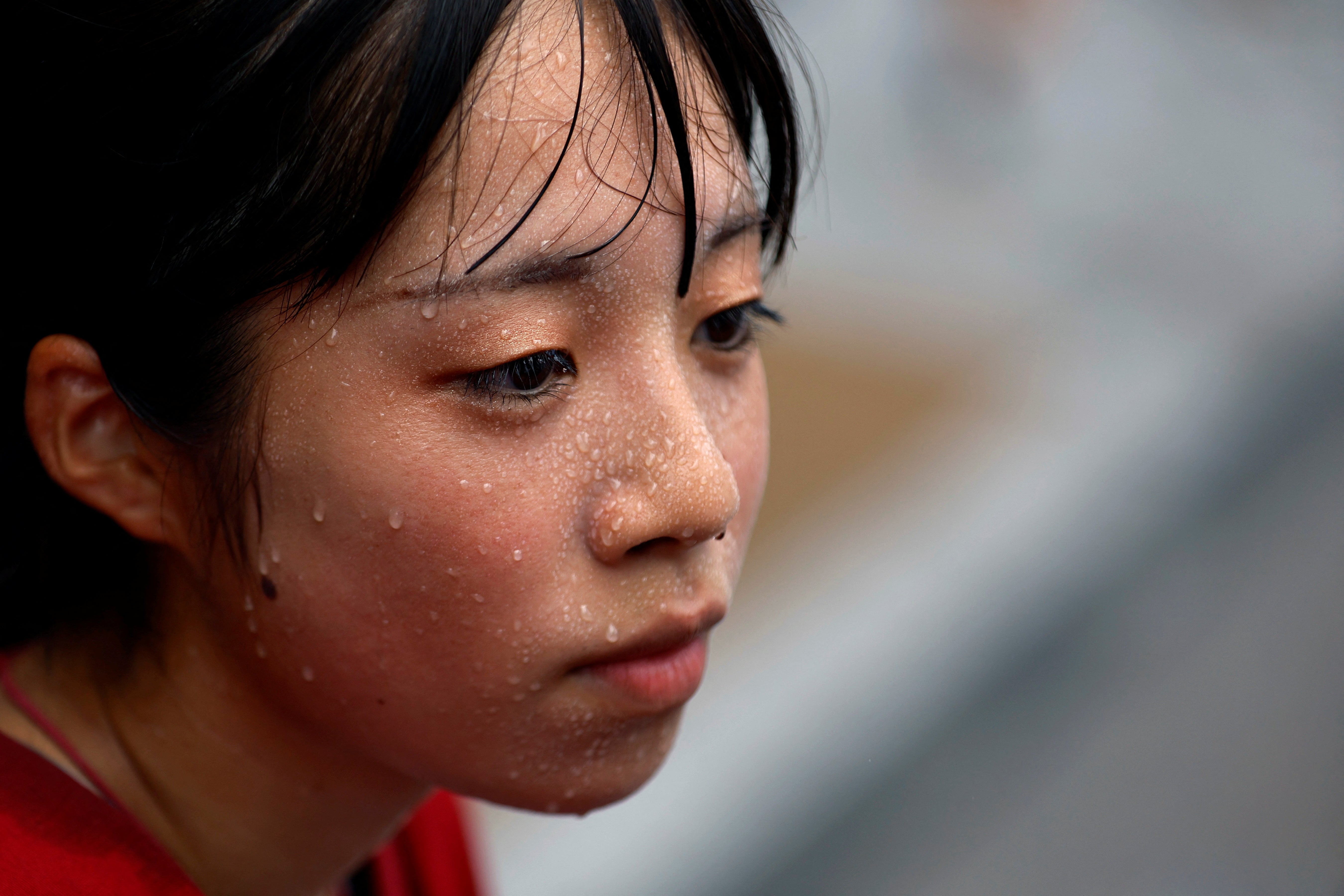 Yuka Akimoto, 21, sweats during her guided tour around Asakusa