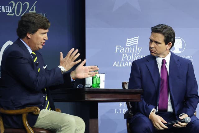 <p>Florida Governor Ron DeSantis fields questions from former Fox News Television personality Tucker Carlson at the Family Leadership Summit on July 14, 2023 in Des Moines, Iowa</p>