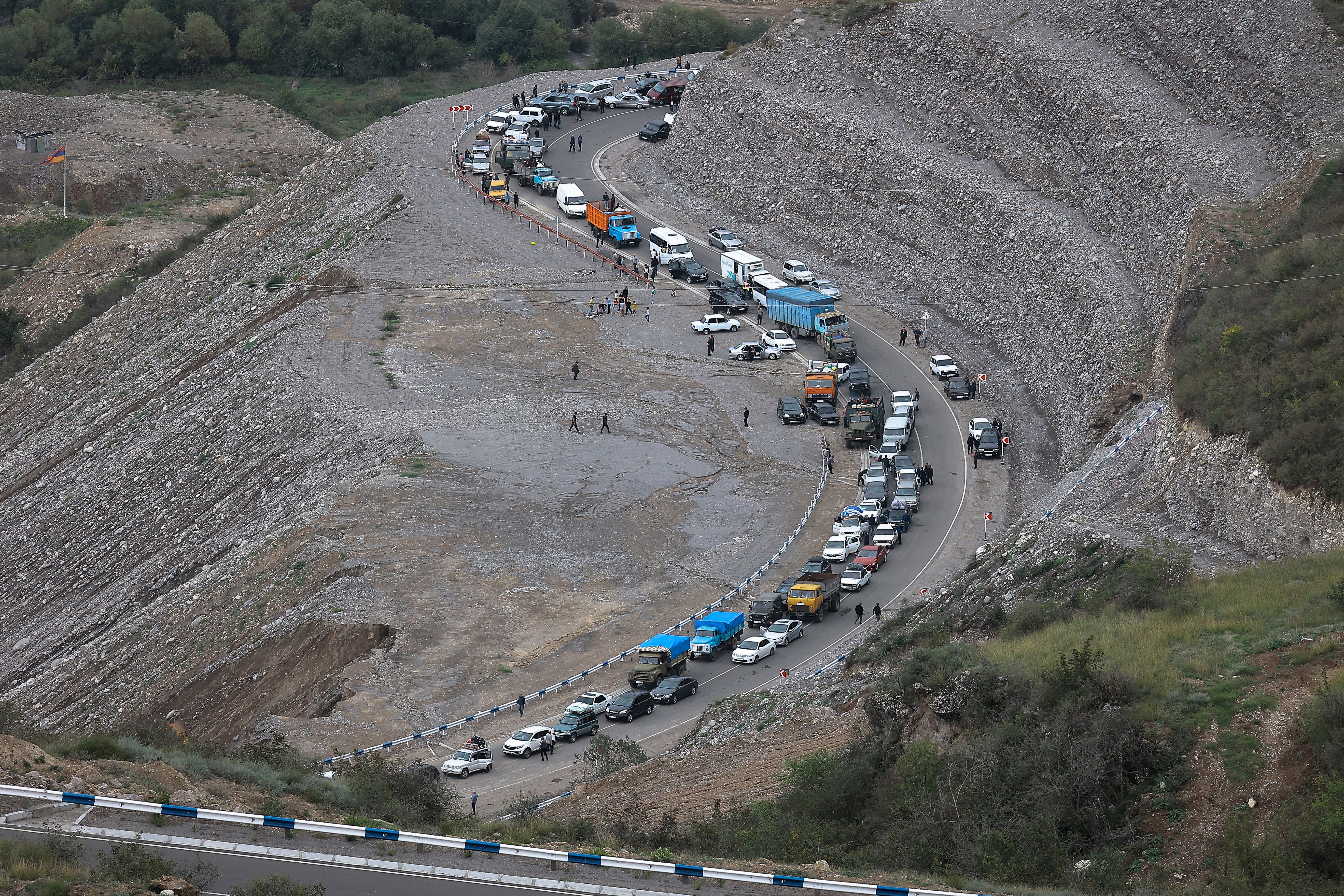 The convoy of cars carrying ethnic Armenians over mountain roads towards Armenia
