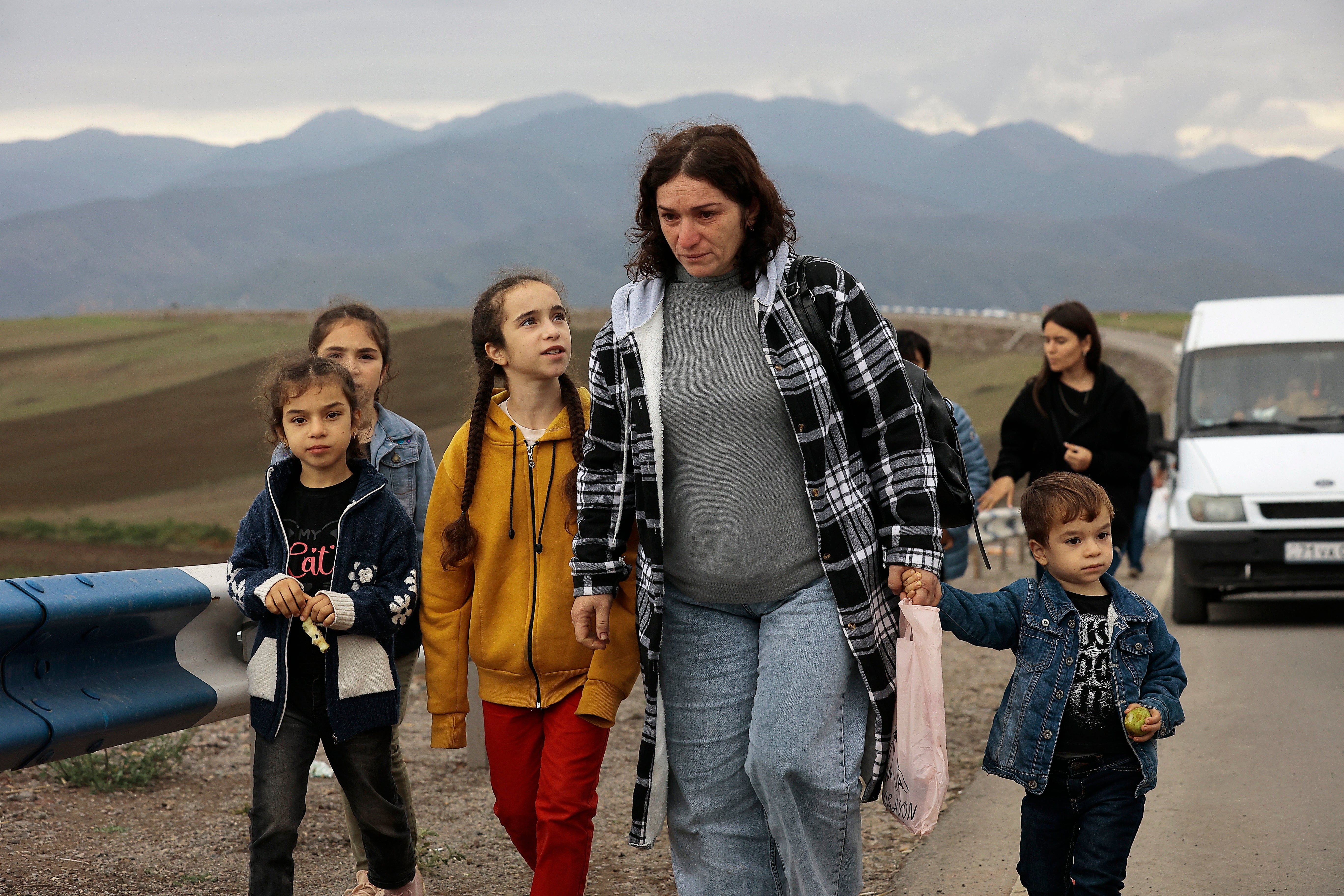 Ethnic Armenians from Nagorno-Karabakh walk to Kornidzor to cross the border