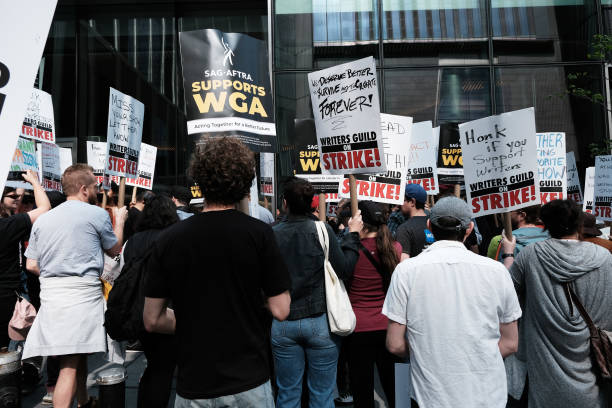 Members of the Writers Guild of America (WGA) East walk on the picket-line outside of HBO and Amazon’s offices on 10 May 2023