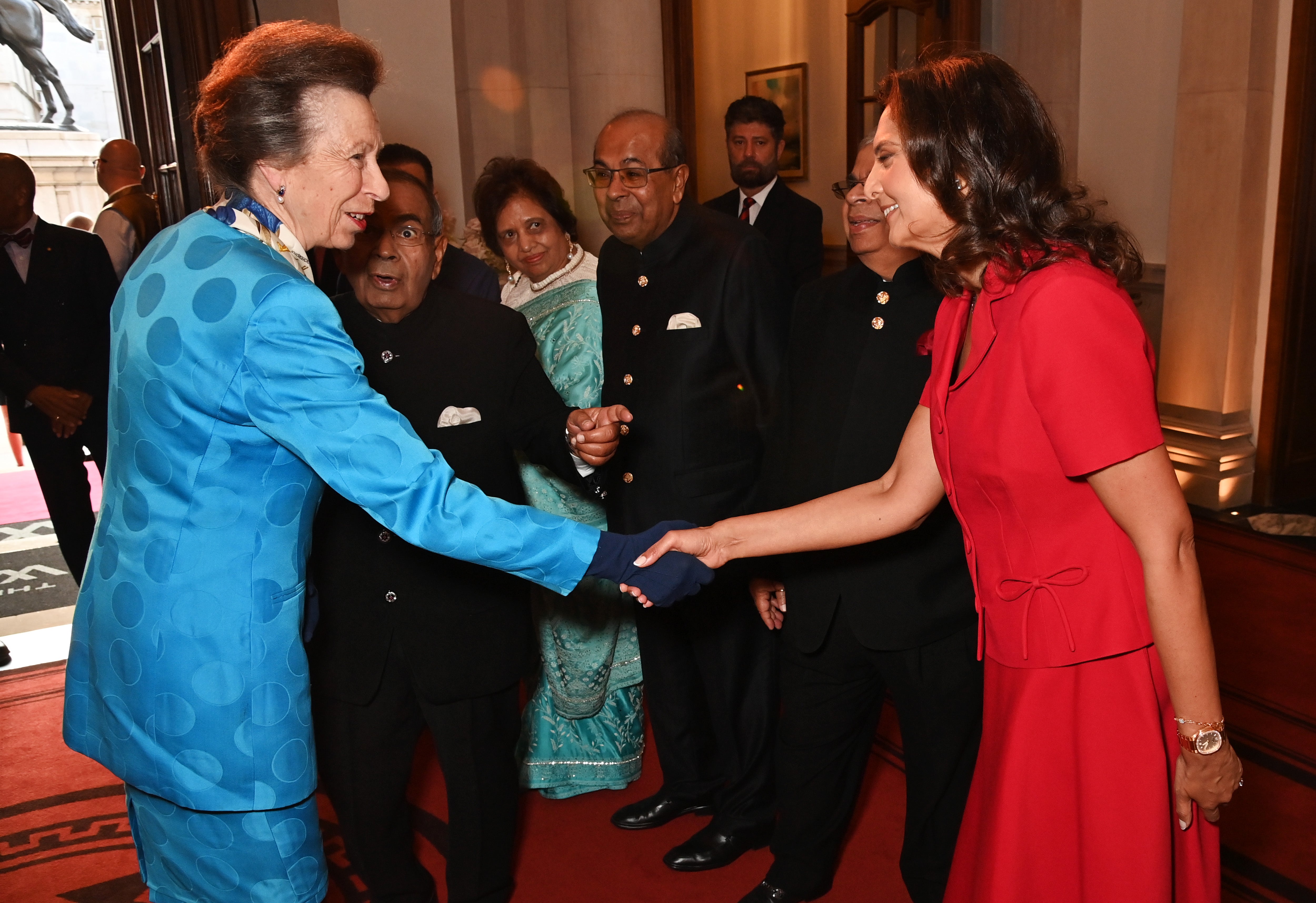 Princess Anne shakes hands with Gopichand P Hinduja, Chairperson of the Hinduja Group, at the inauguration
