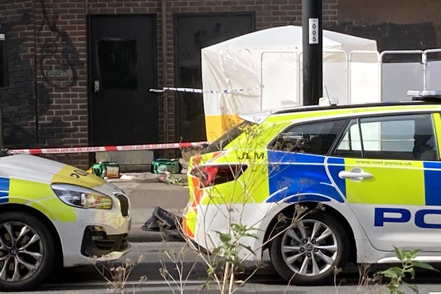 A forensic tent has been put up at the scene where a 15-year-old girl was stabbed to death on her way to school in Croydon, south London on Wednesday (Jordan Reynolds/PA)