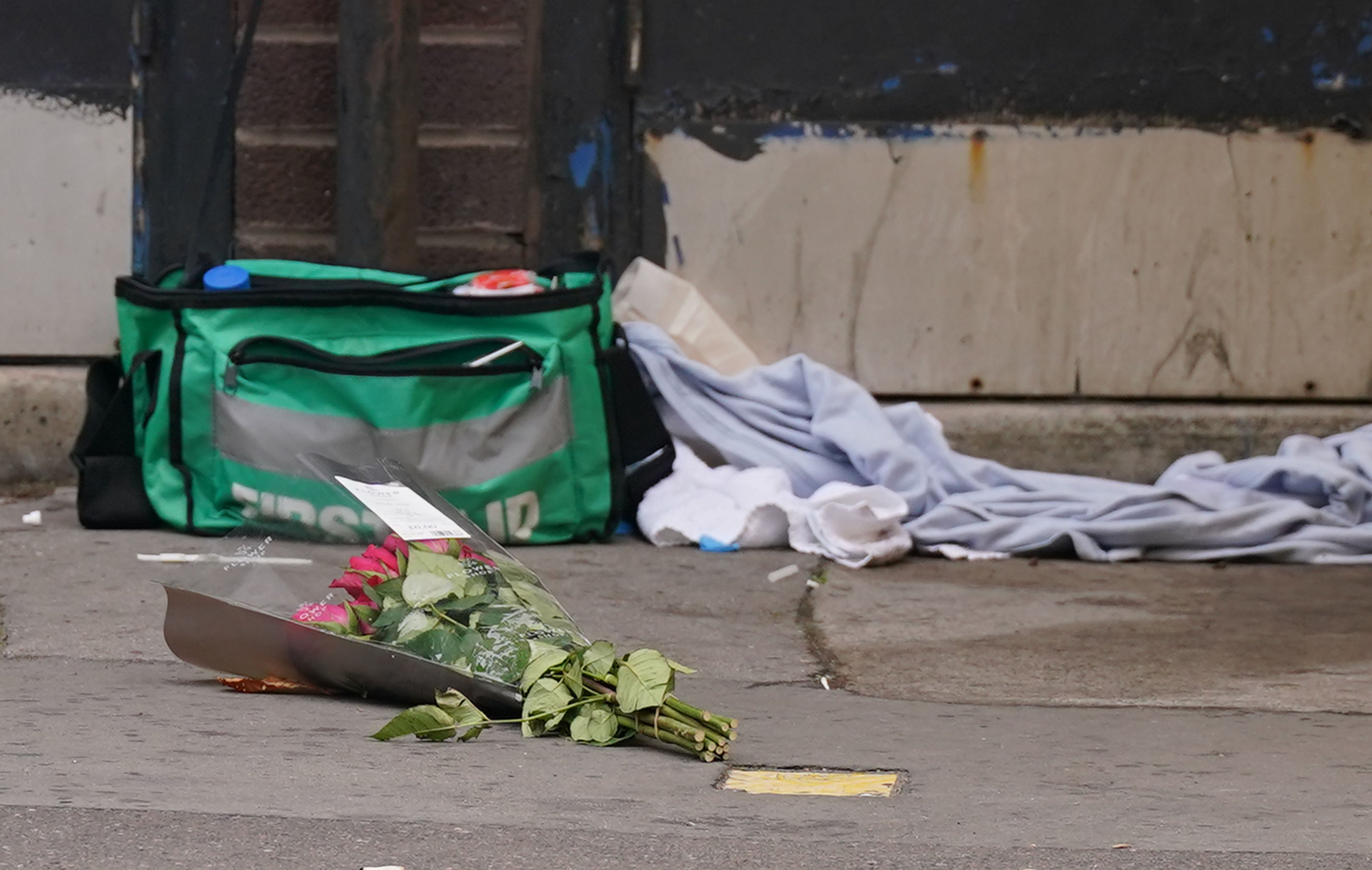 A bouquet of roses left at the scene where the girl was killed