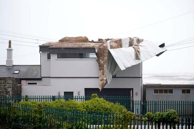 The scene in Youghal, Co Cork, where a roof was blown off a building (Niall Carson/PA)
