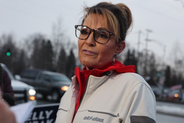 <p>Former Governor of Alaska and Republican candidate for Congress, Sarah Palin, speaks to the media as she campaigns with supporters on November 08, 2022 in Anchorage, Alaska</p>