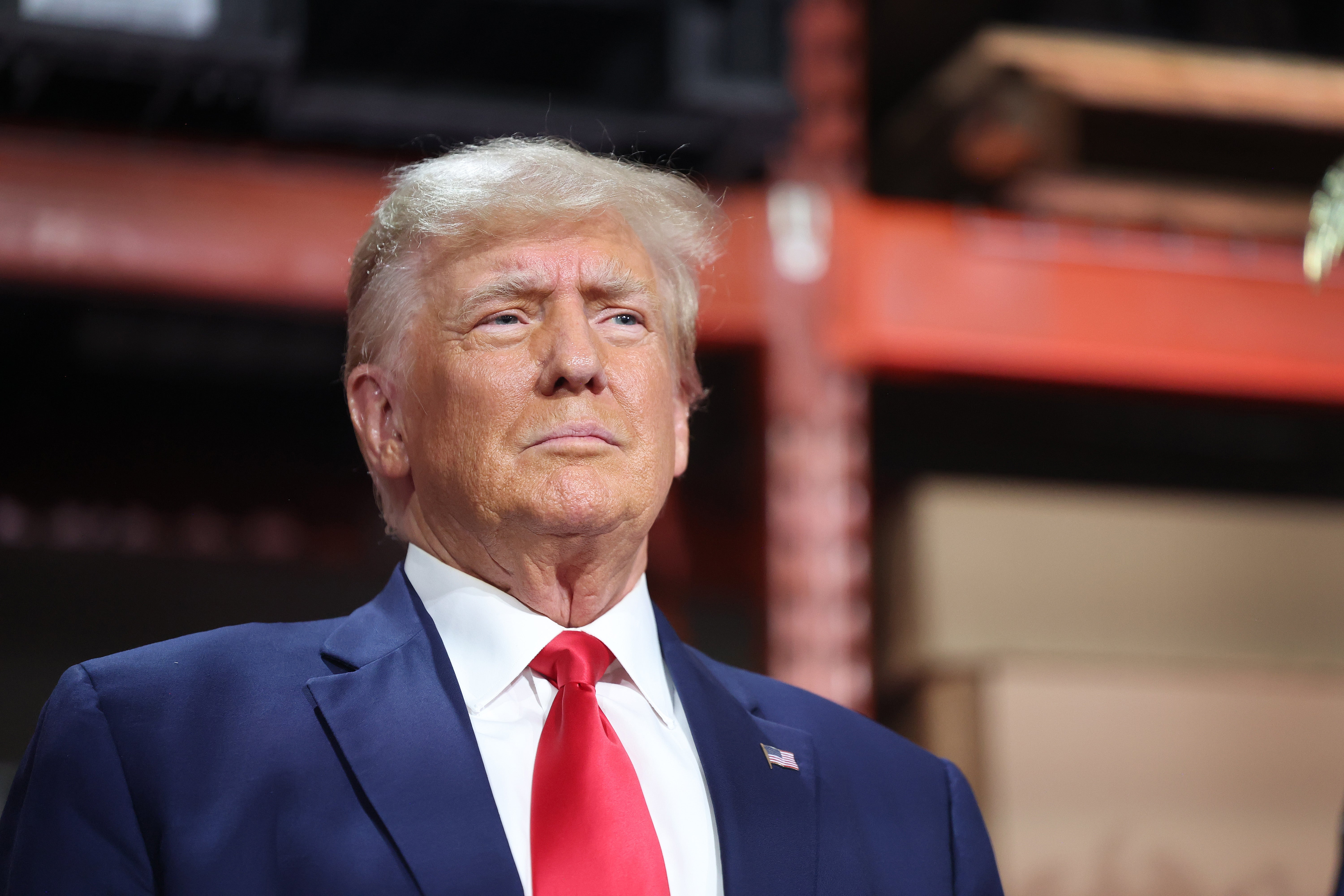 Republican presidential candidate former President Donald Trump speaks to guests during a campaign stop at Drake Enterprises, an automotive parts manufacturer, on September 27, 2023 in Clinton Township, Michigan.