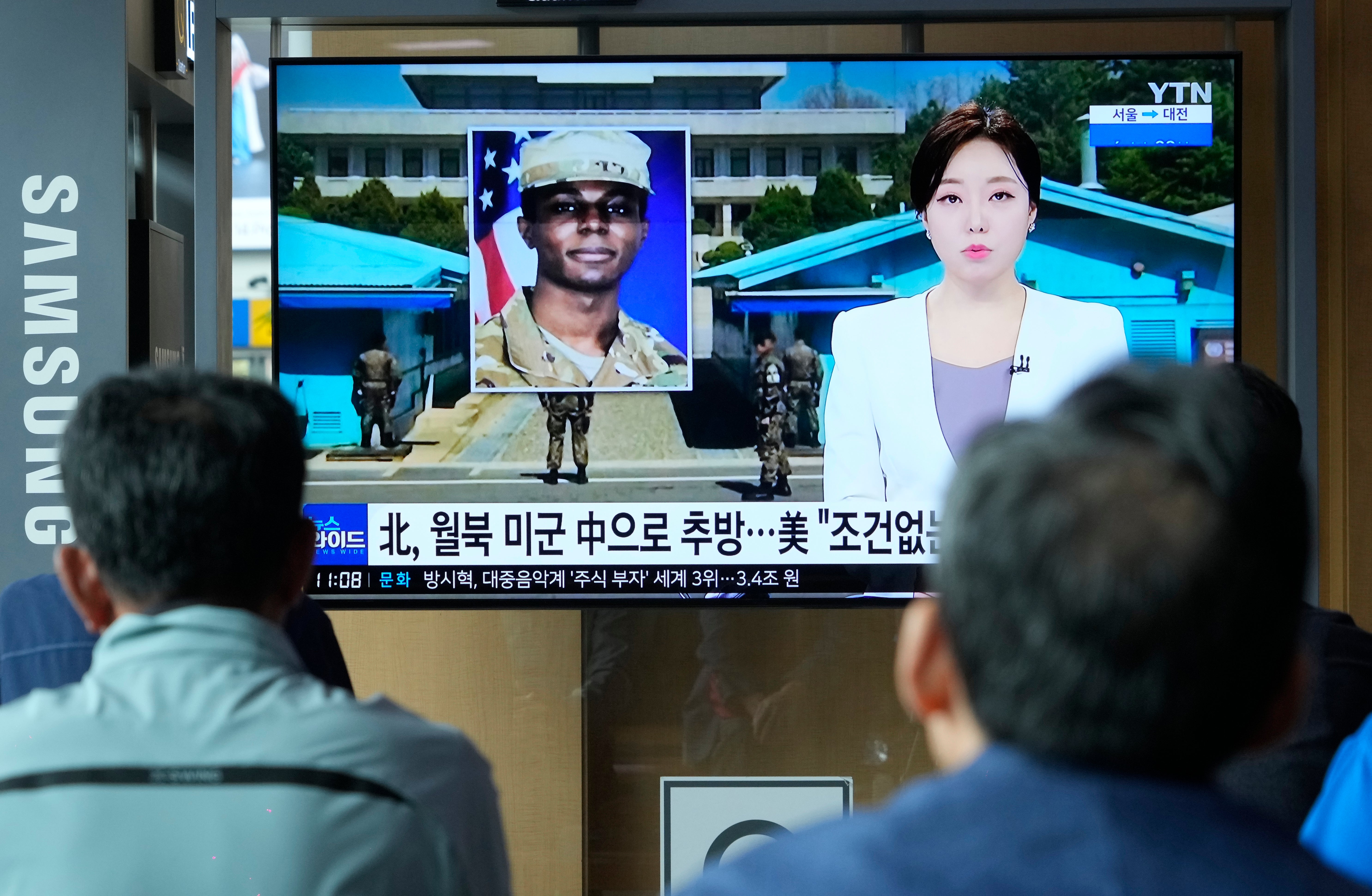 A TV screen shows a file image of American soldier Travis King during a news program at the Seoul Railway Station in Seoul, South Korea,