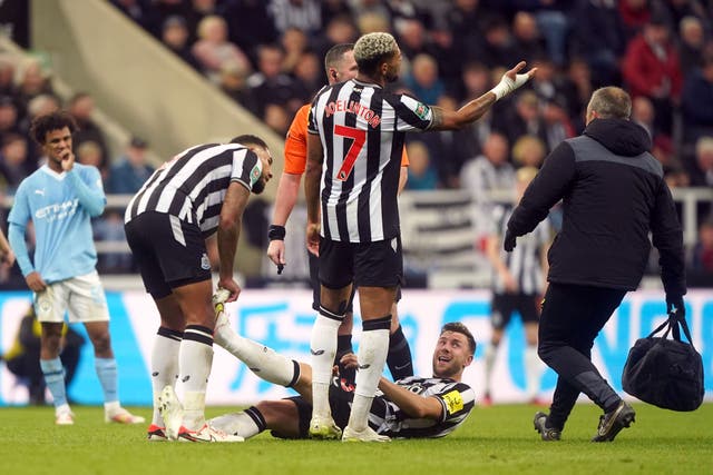 Newcastle’s Paul Dummett (on the ground) turned in a fine individual display against Manchester City (Owen Humphreys/PA)