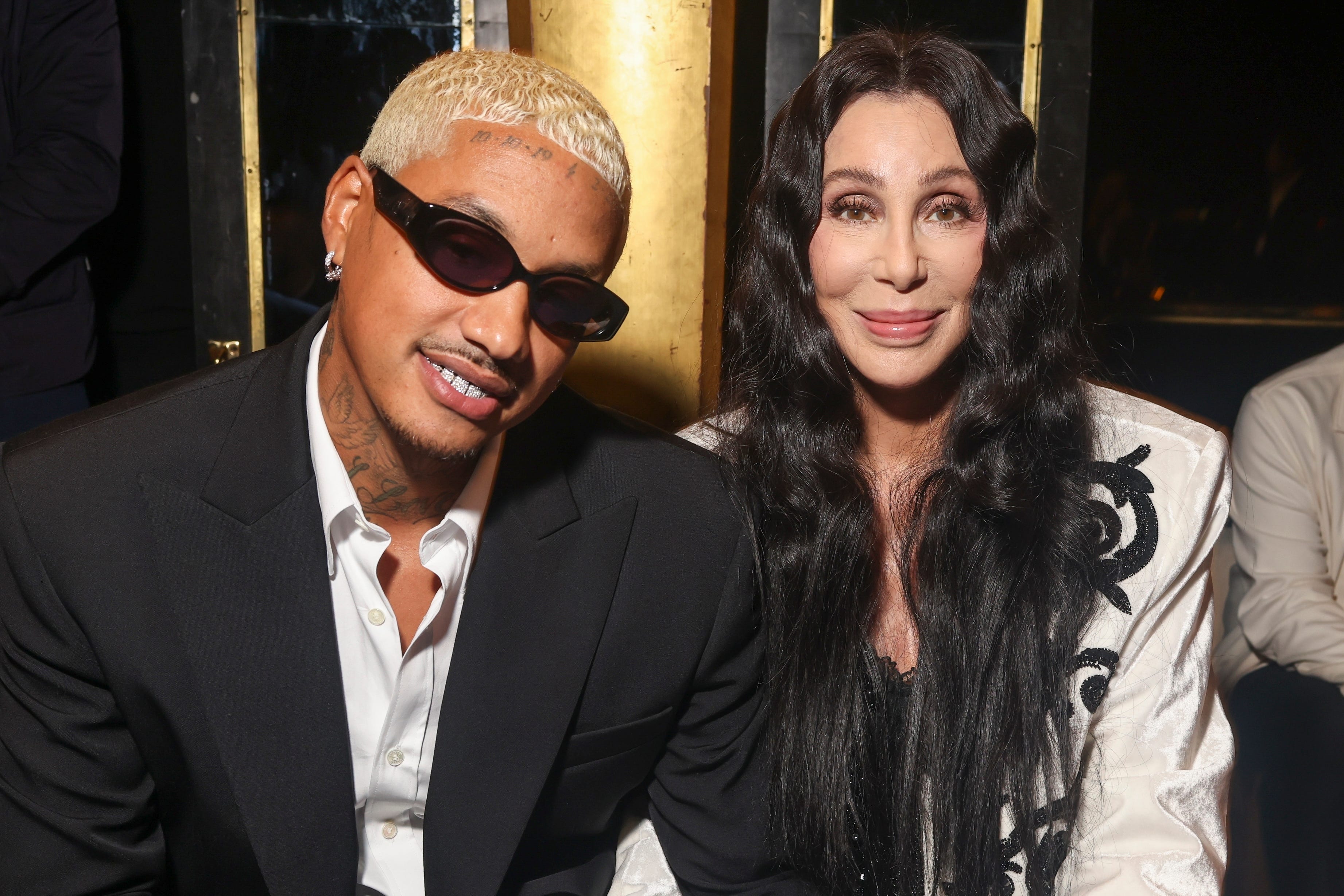 Cher (right) and boyfriend Alexander Edwards were front row at the Balmain spring/summer 2024 show (Vianney Le Caer/AP)