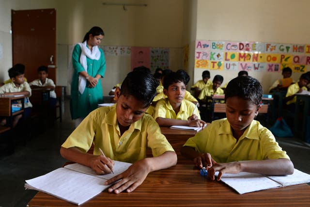 <p>This photograph taken on 18 August 2017 shows young members of the Musahar community studying in a classroom at a school in Gonpura in Bihar</p>