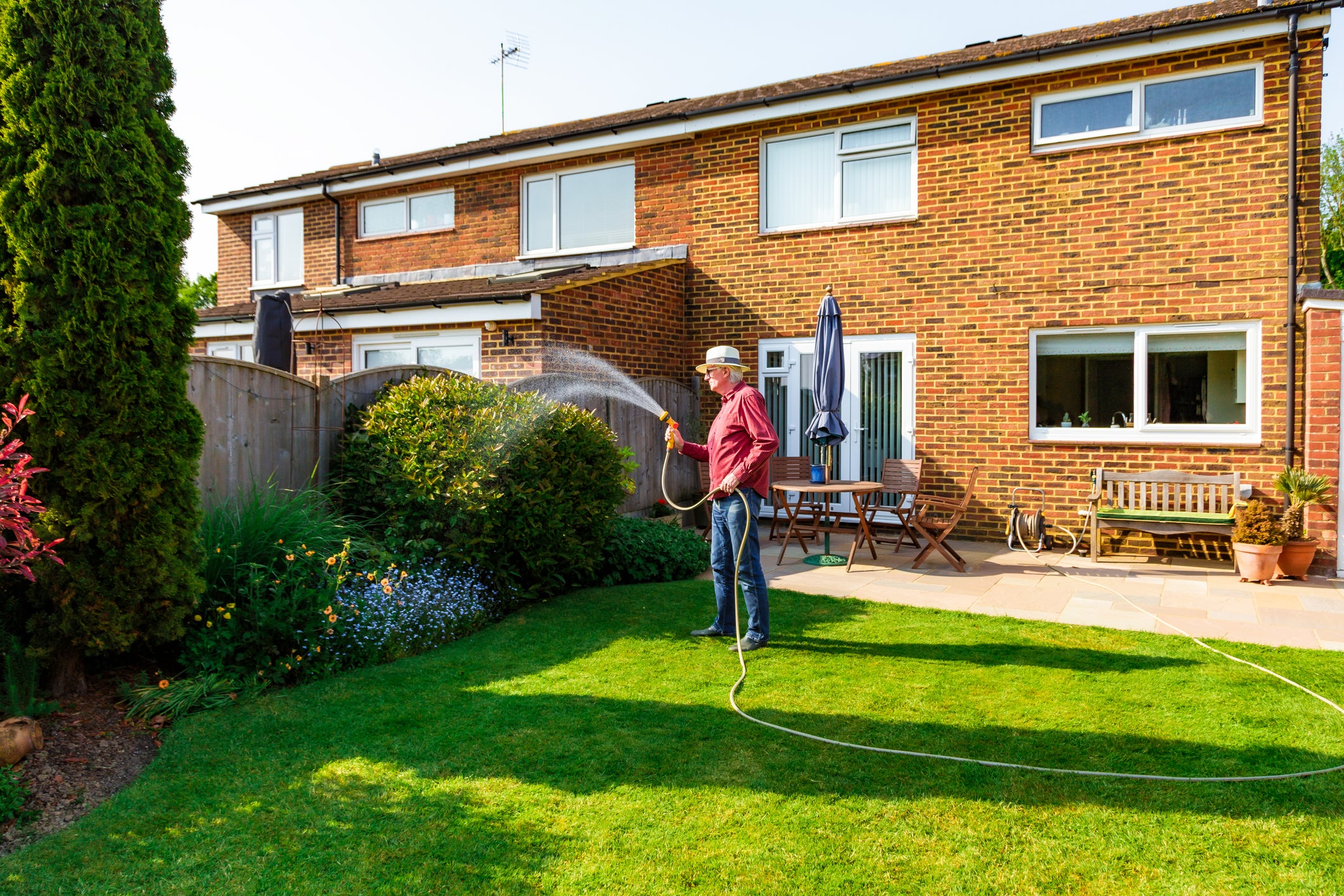 File photo: A man waters his garden