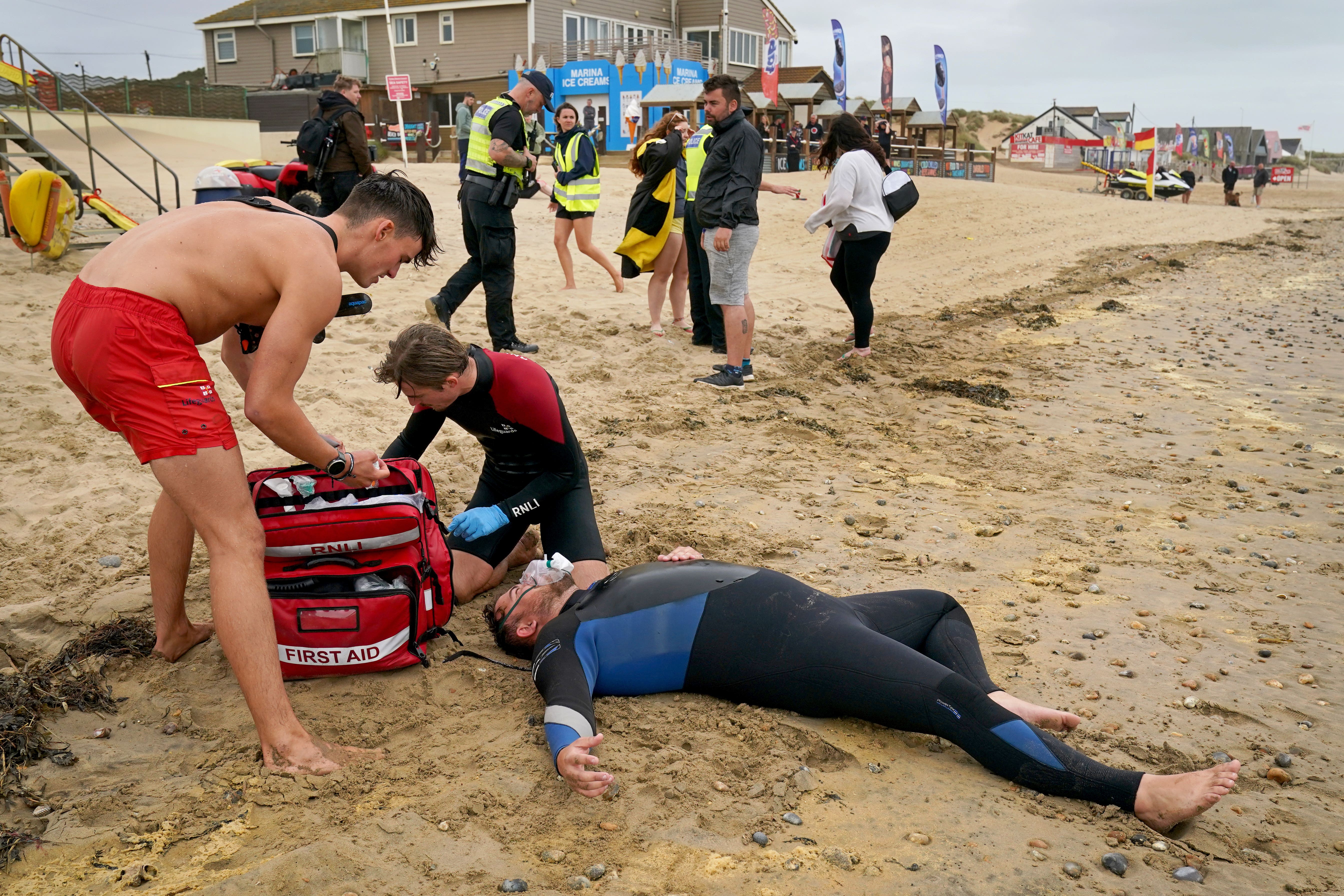 Lifeguards practise their skills on an actor during a multi-agency exercise to test emergency response at Camber Sands (Gareth Fuller/PA)