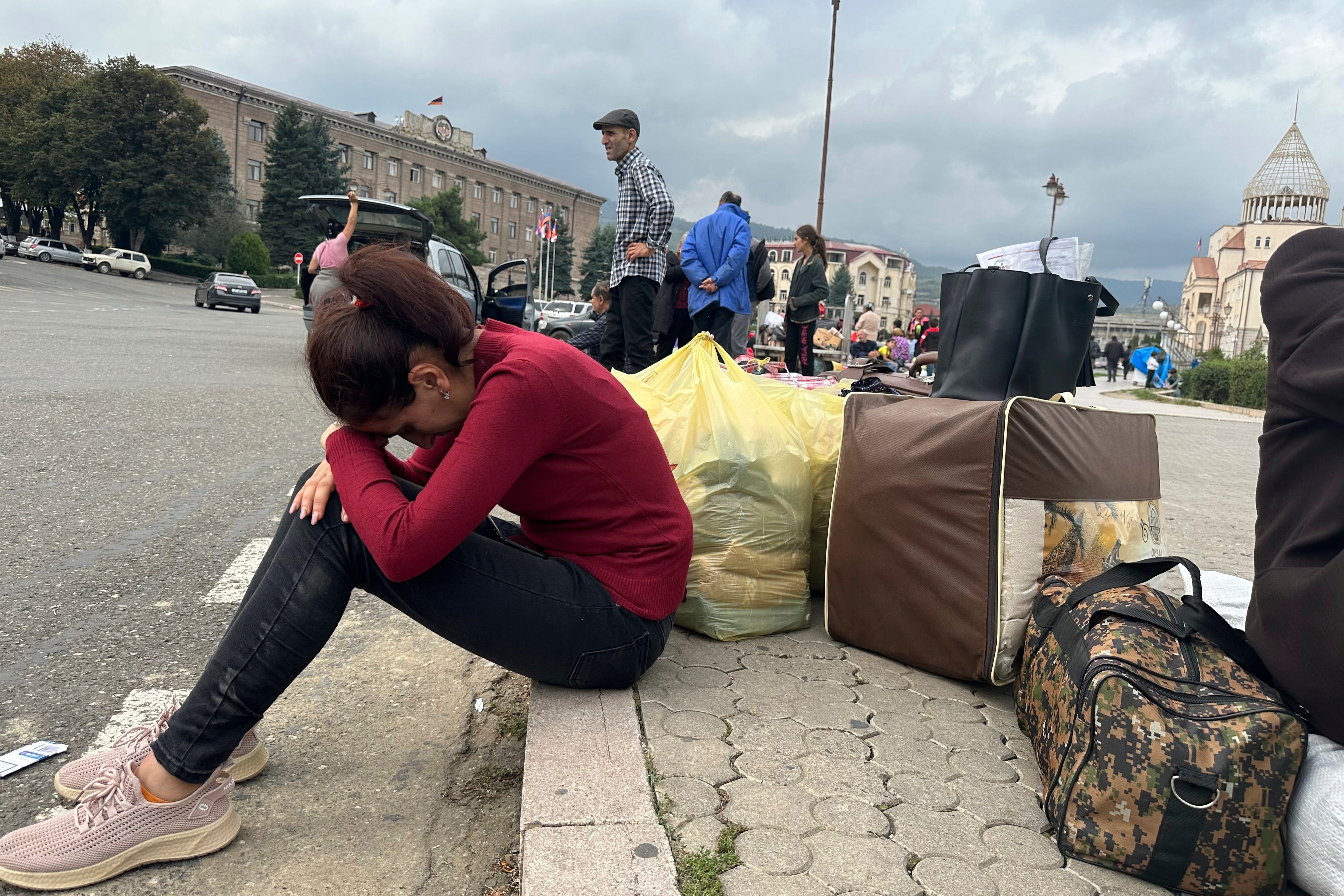 Ethnic Armenians gather in hope to leave Nagorno-Karabakh region for Armenia in the center of Stepanakert