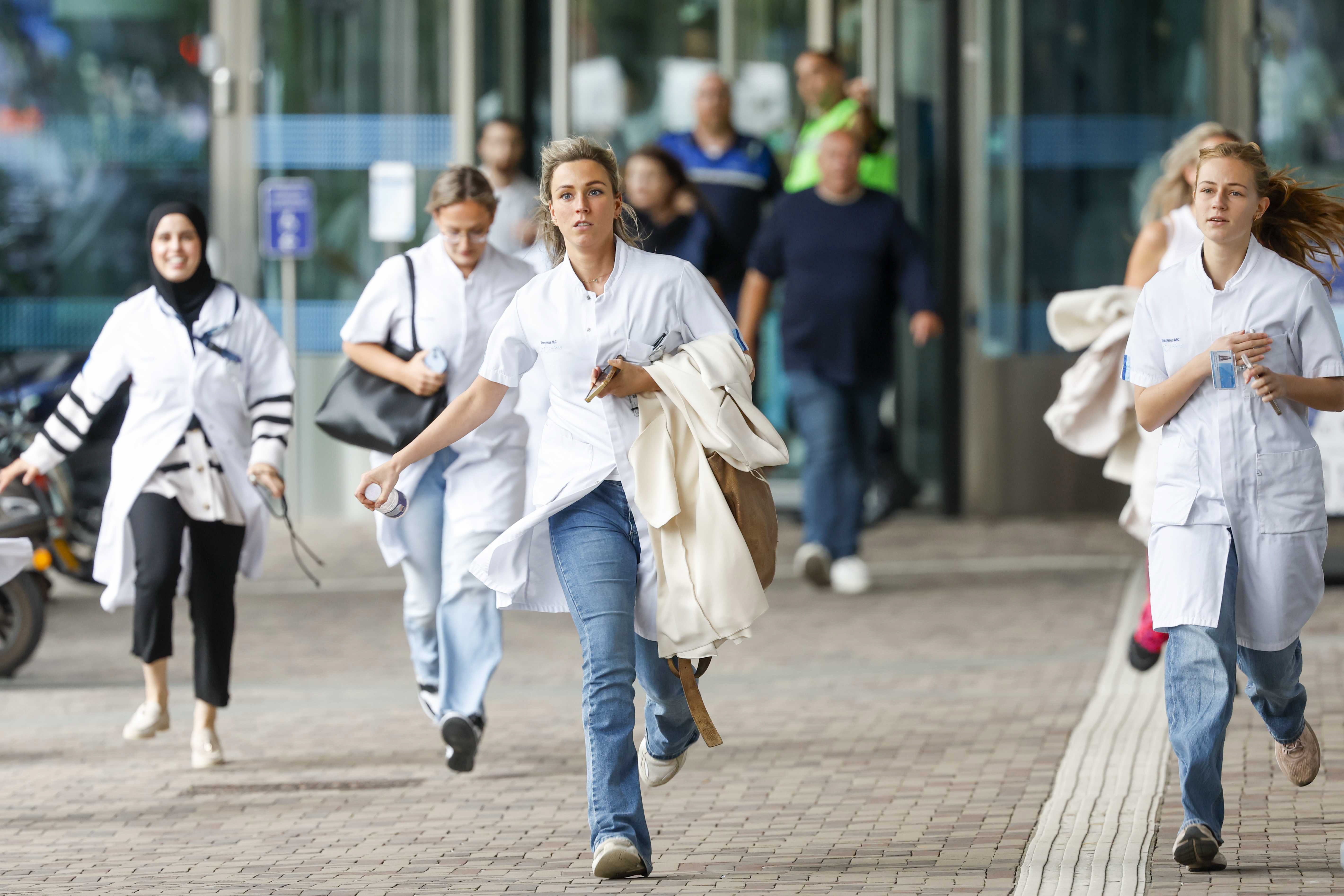 Medical staff leave the Erasmus MC Rotterdam hospital on Rochussenstraat