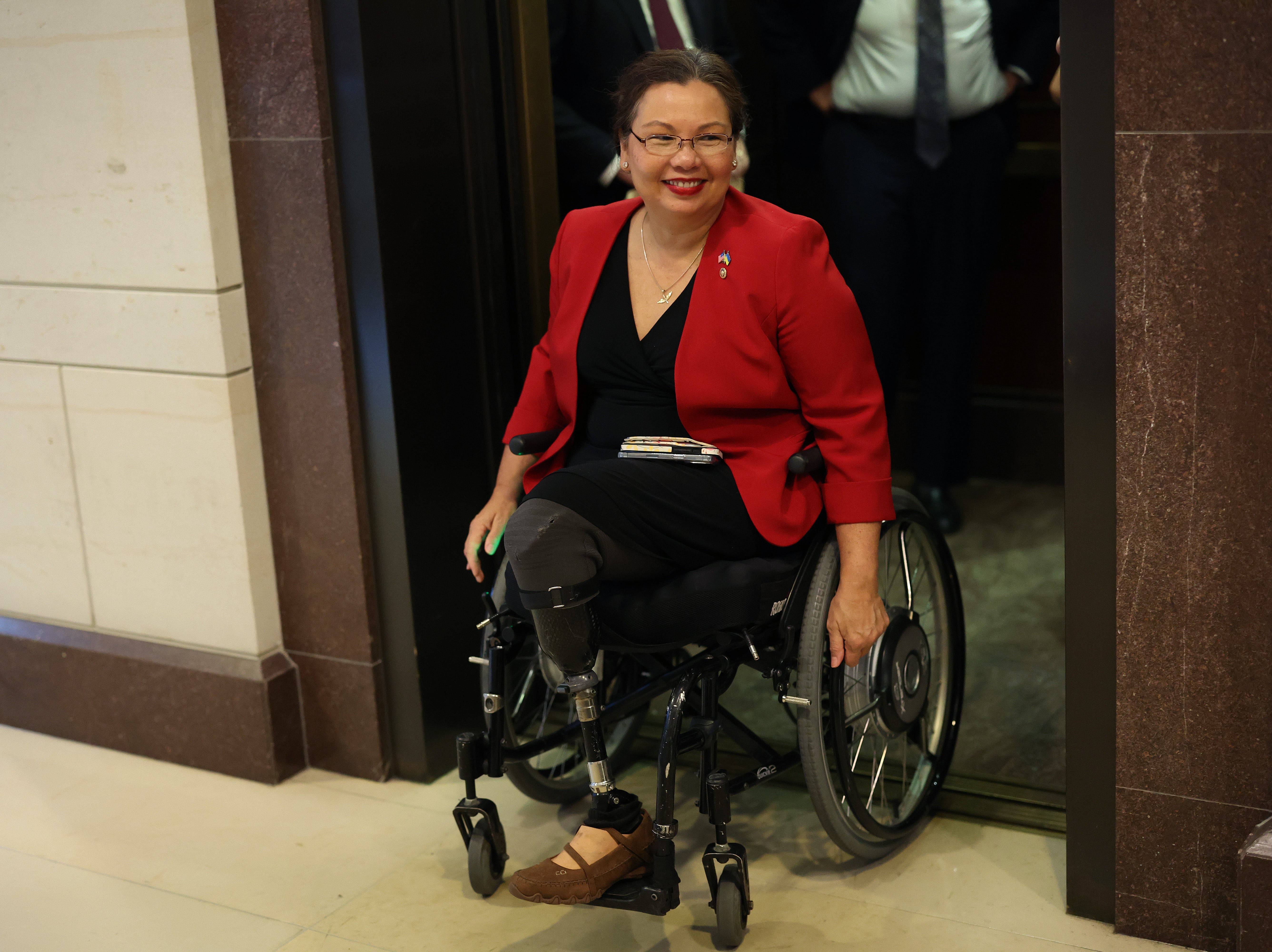 WASHINGTON, DC - SEPTEMBER 20: Sen. Tammy Duckworth (D-IL) arrives for a briefing on Ukraine at the U.S. Capitol on September 20, 2023 in Washington, DC. The Illinois Senator uses a wheelchair and has prosthetic legs after her helicopter was shot down in Iraq.
