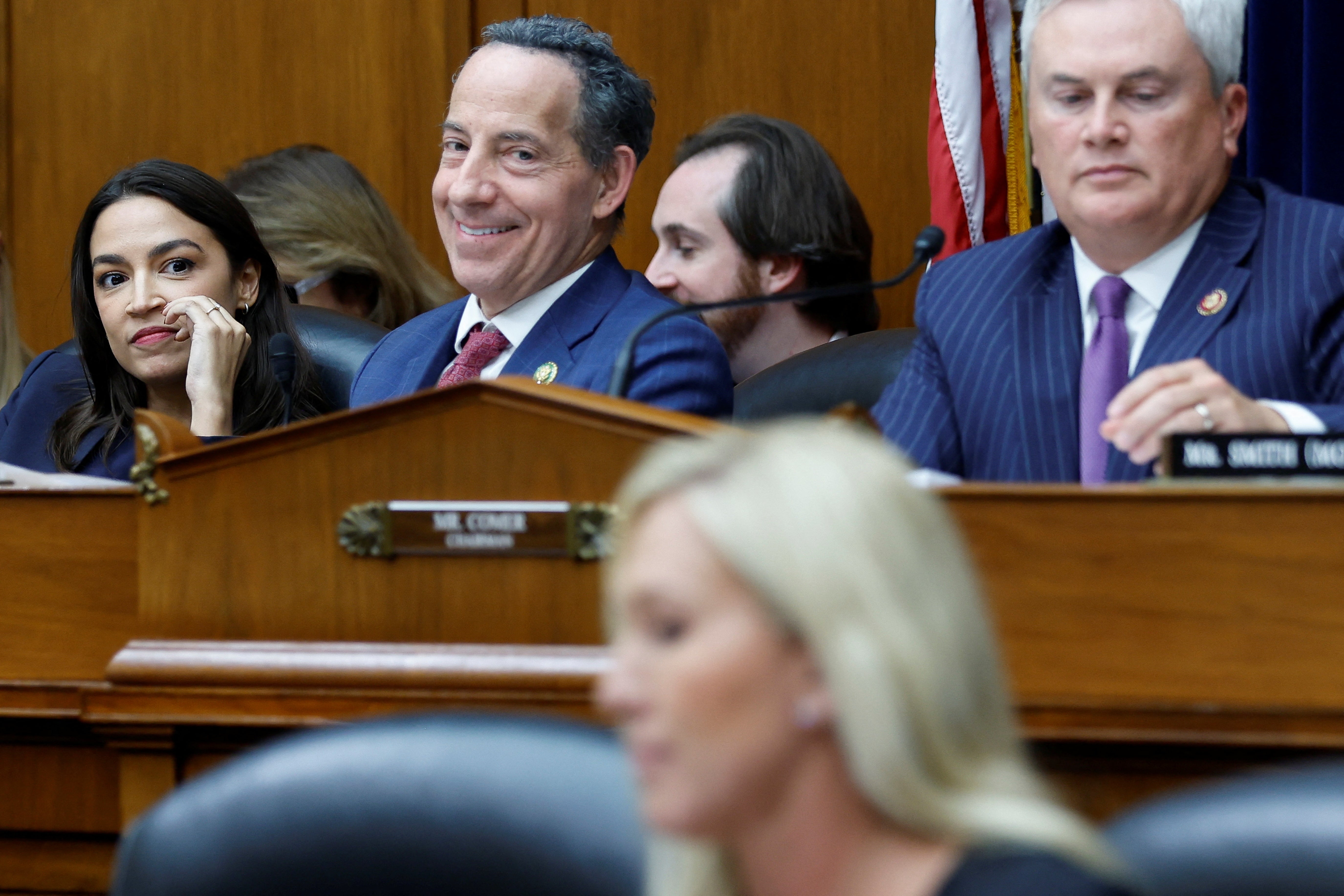 Democrats Alexandria Ocasio-Cortez, left, and Jamie Raskin, second left, look on as Republicans James Comer and Marjorie Taylor Greene take part in their first impeachment hearing against President Biden