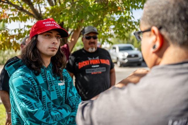 <p>A man pictured wearing a red Maga hat before a shooting during a protest over a statue of a  Spanish conquistador in New Mexico </p>
