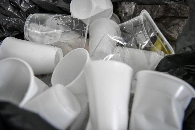 Disposable drinking cups in a bin (Ben Birchall/PA)