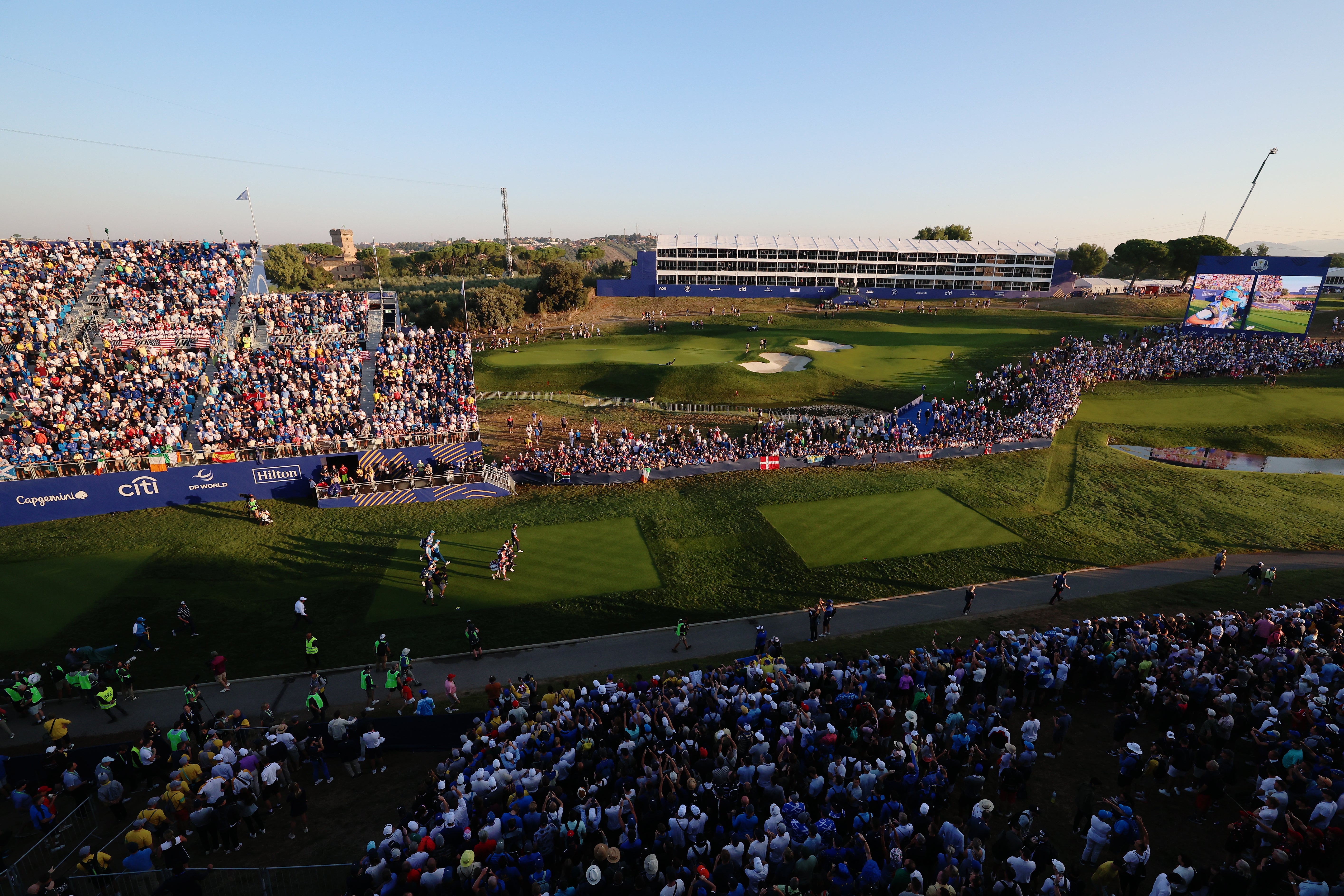 The stands have been packed around the first tee