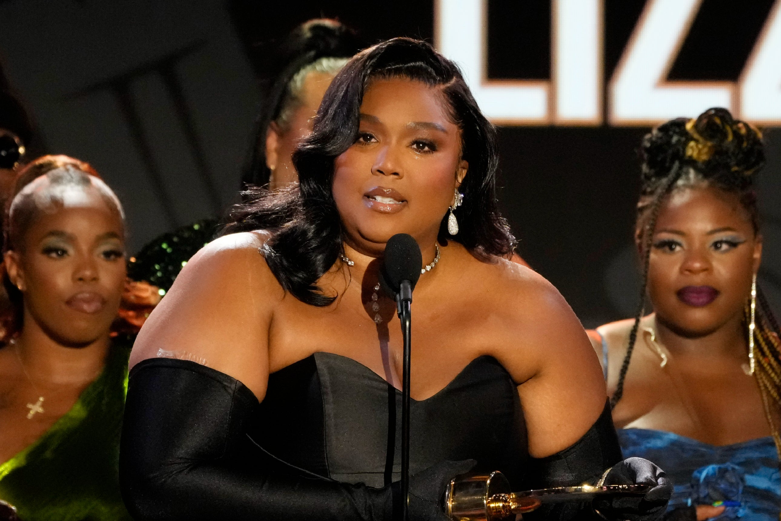 Lizzo accepting the Quincy Jones Humanitarian Award at the Black Music Action Coalition Gala in September