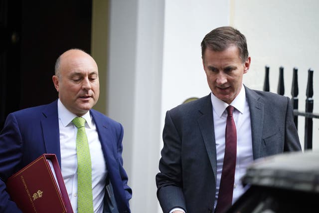 Economic Secretary to the Treasury Andrew Griffith MP (left) and Chancellor of the Exchequer Jeremy Hunt depart Downing Street, London (Aaron Chown/PA)