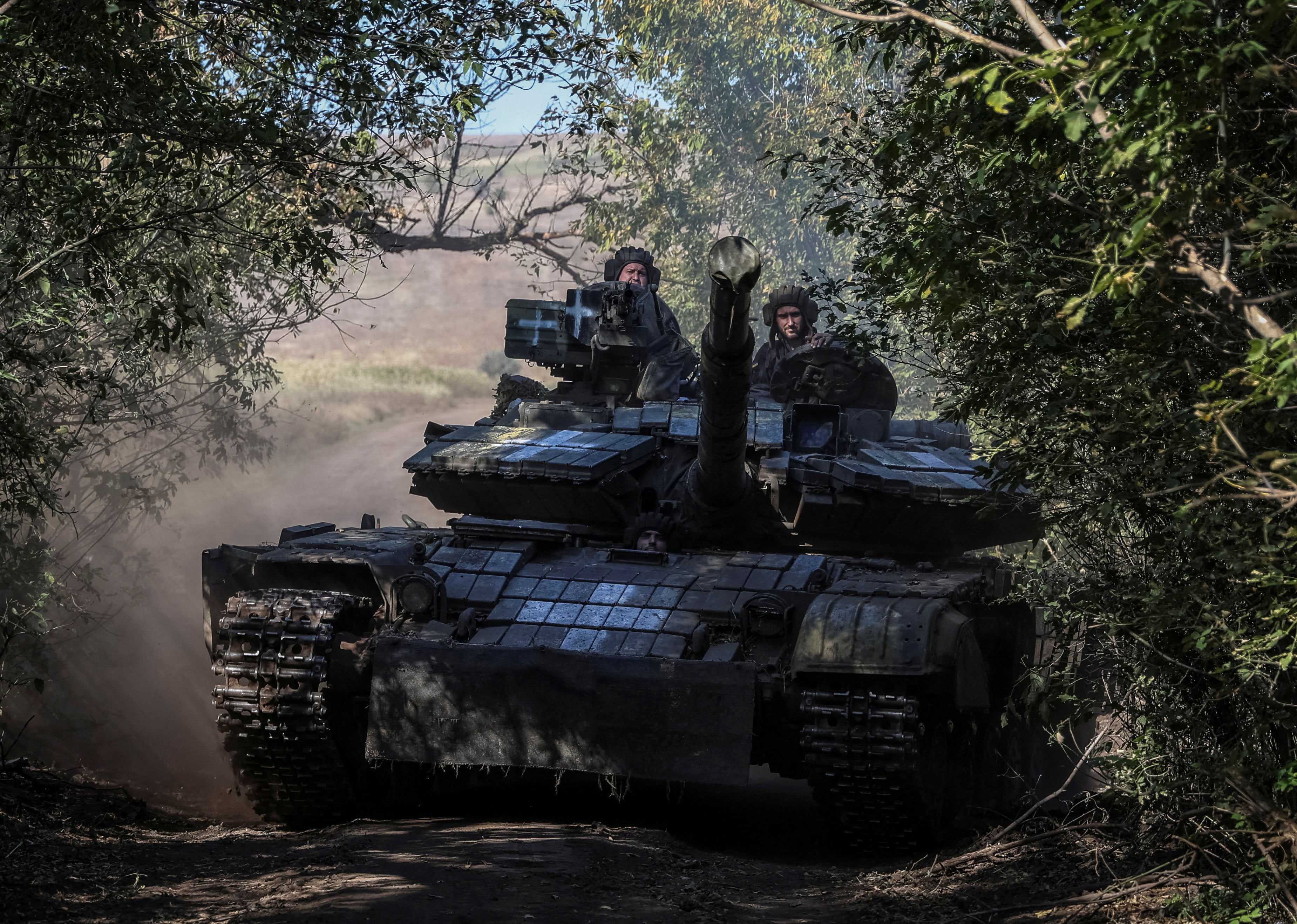 Ukrainian servicemen ride a tank in Donetsk region, eastern Ukraine