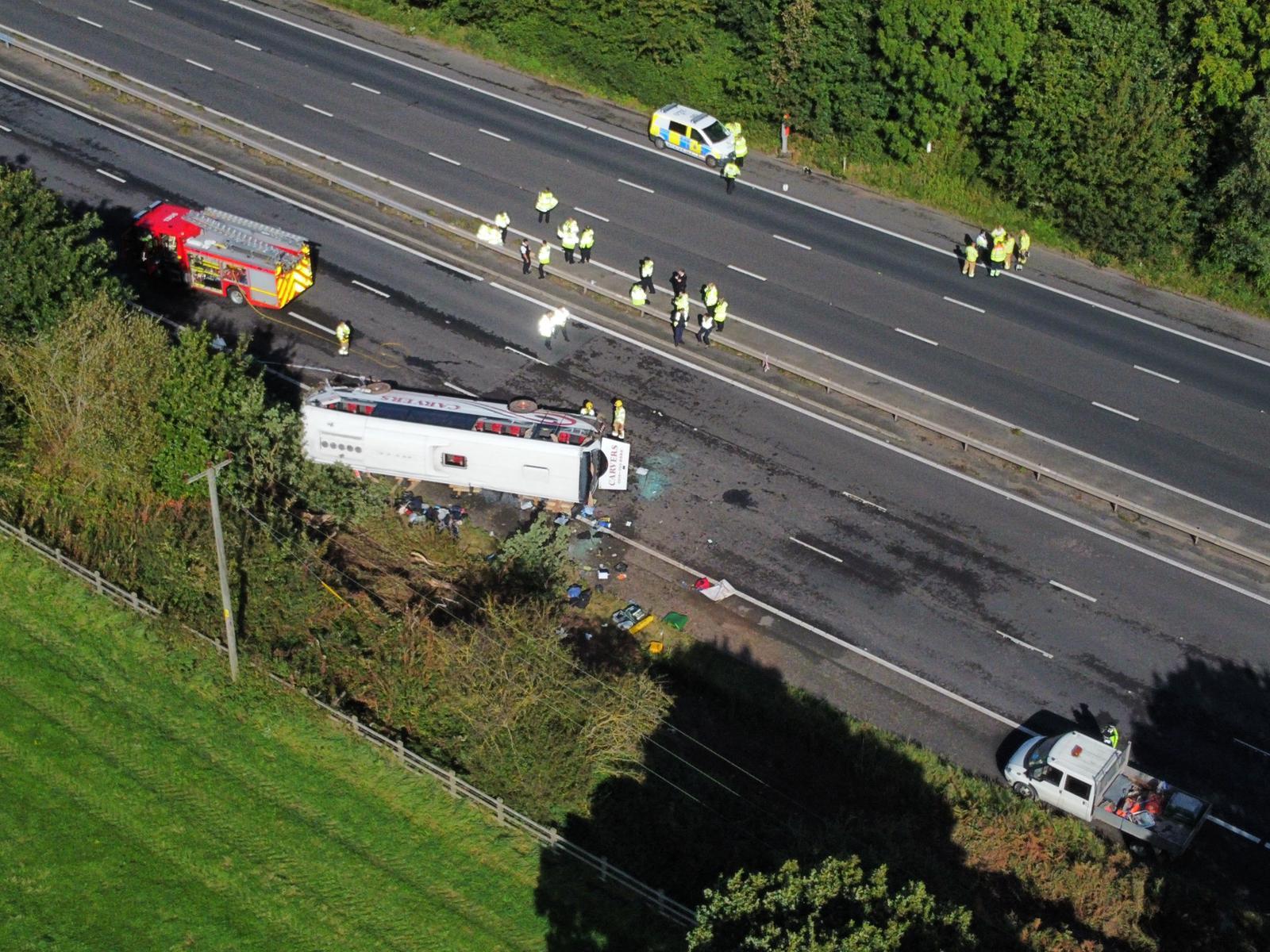 The bus hit a reservation before overturning on the M53
