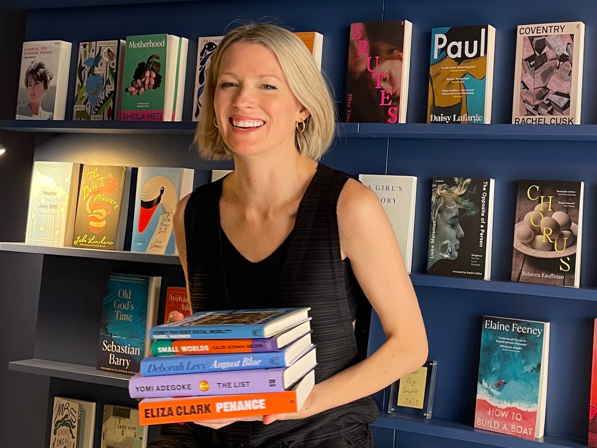 <p>Alex Holder at her new bookshop in Lisbon</p>