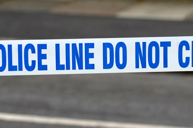 A generic stock photo of police tape outside a murder scene in Wallasey, Merseyside.